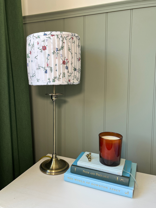 Pleated lampshade with white, red and blue floral fabric