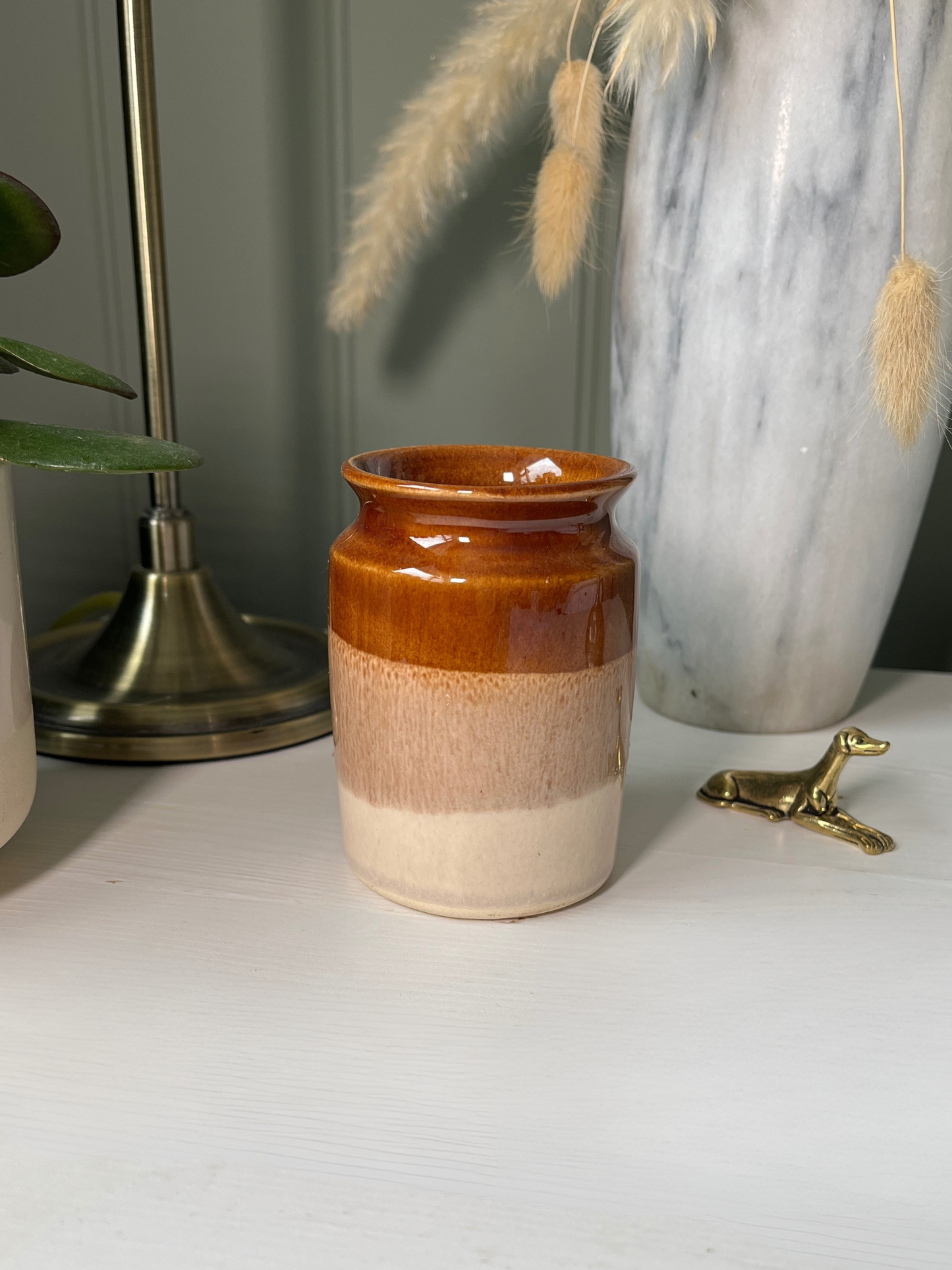 Handmade vintage pottery jug or vase with dipped cream and brown finish