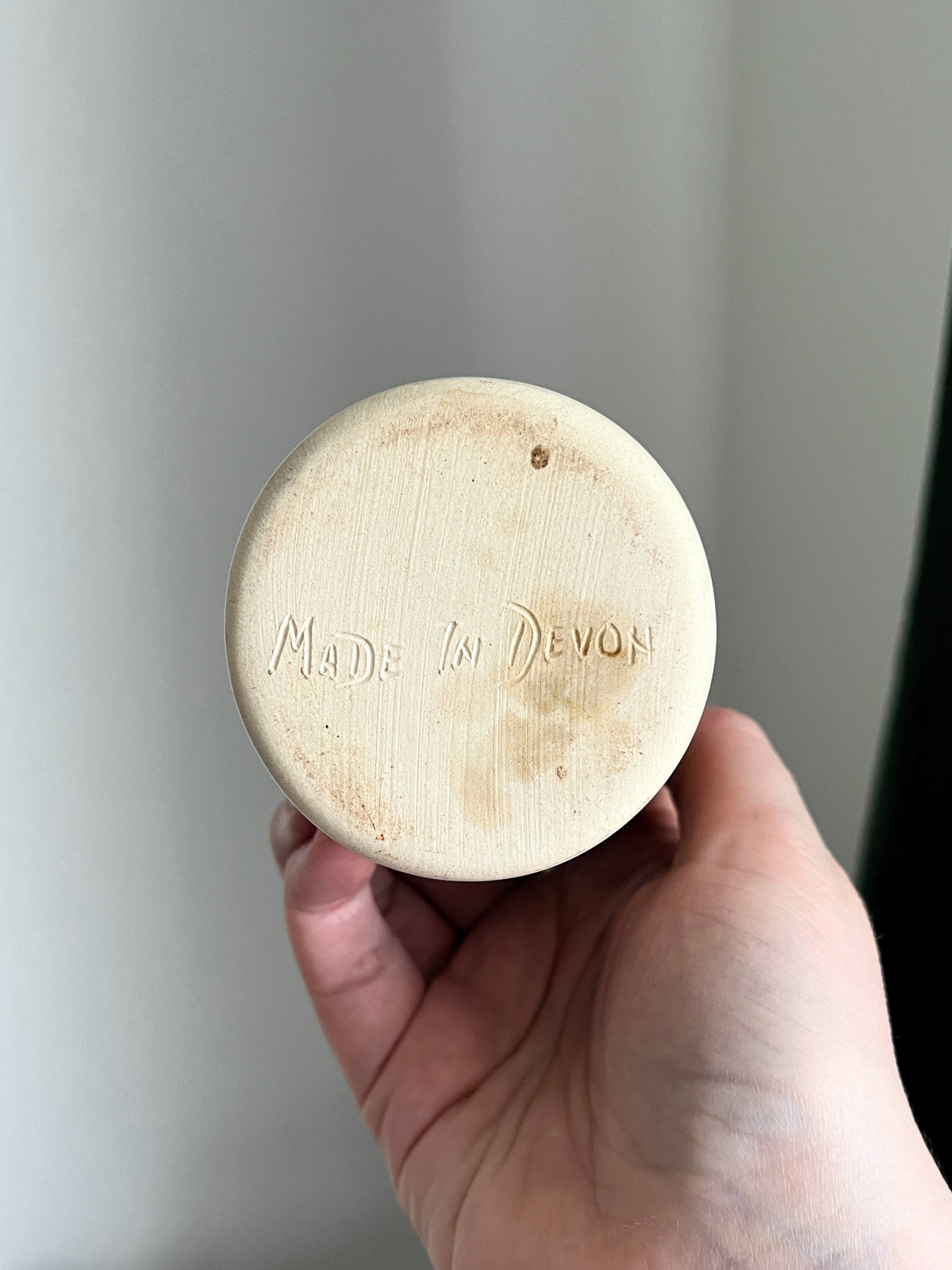 Handmade vintage pottery jug or vase with dipped cream and brown finish