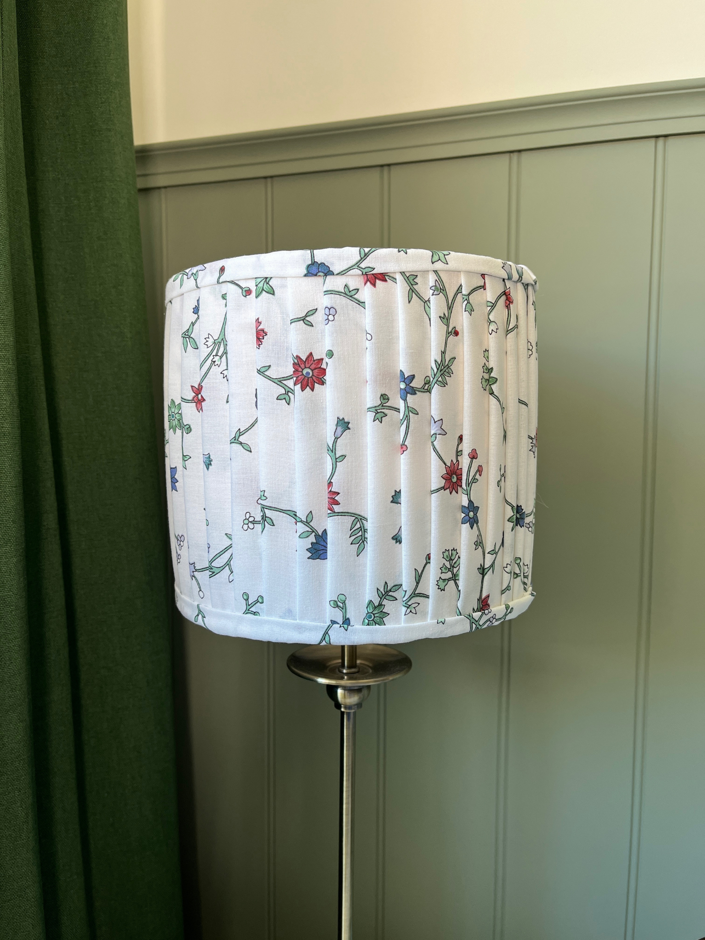 Pleated lampshade with white, red and blue floral fabric