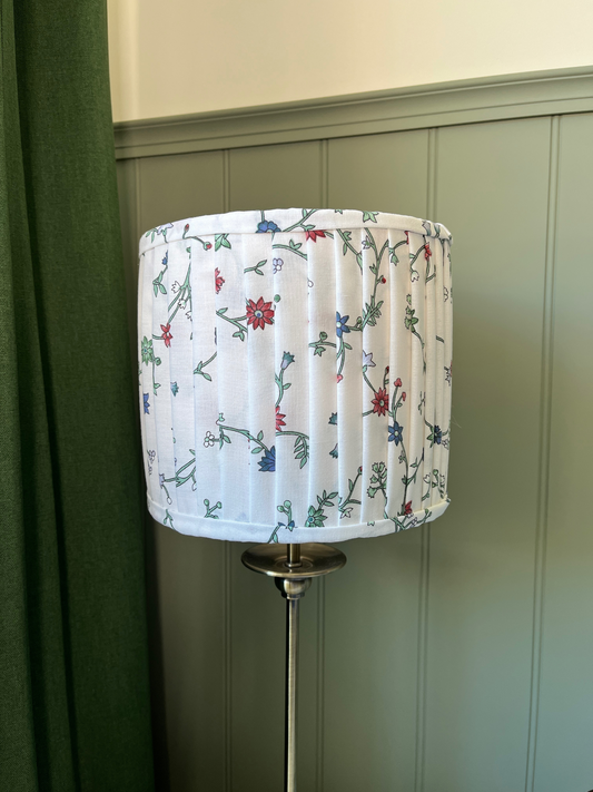Pleated lampshade with white, red and blue floral fabric