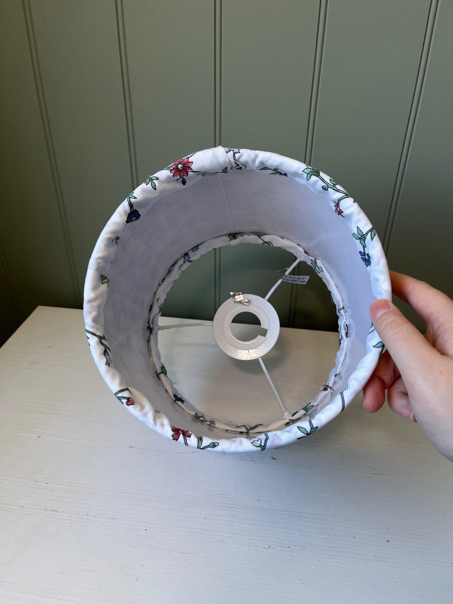 Pleated lampshade with white, red and blue floral fabric