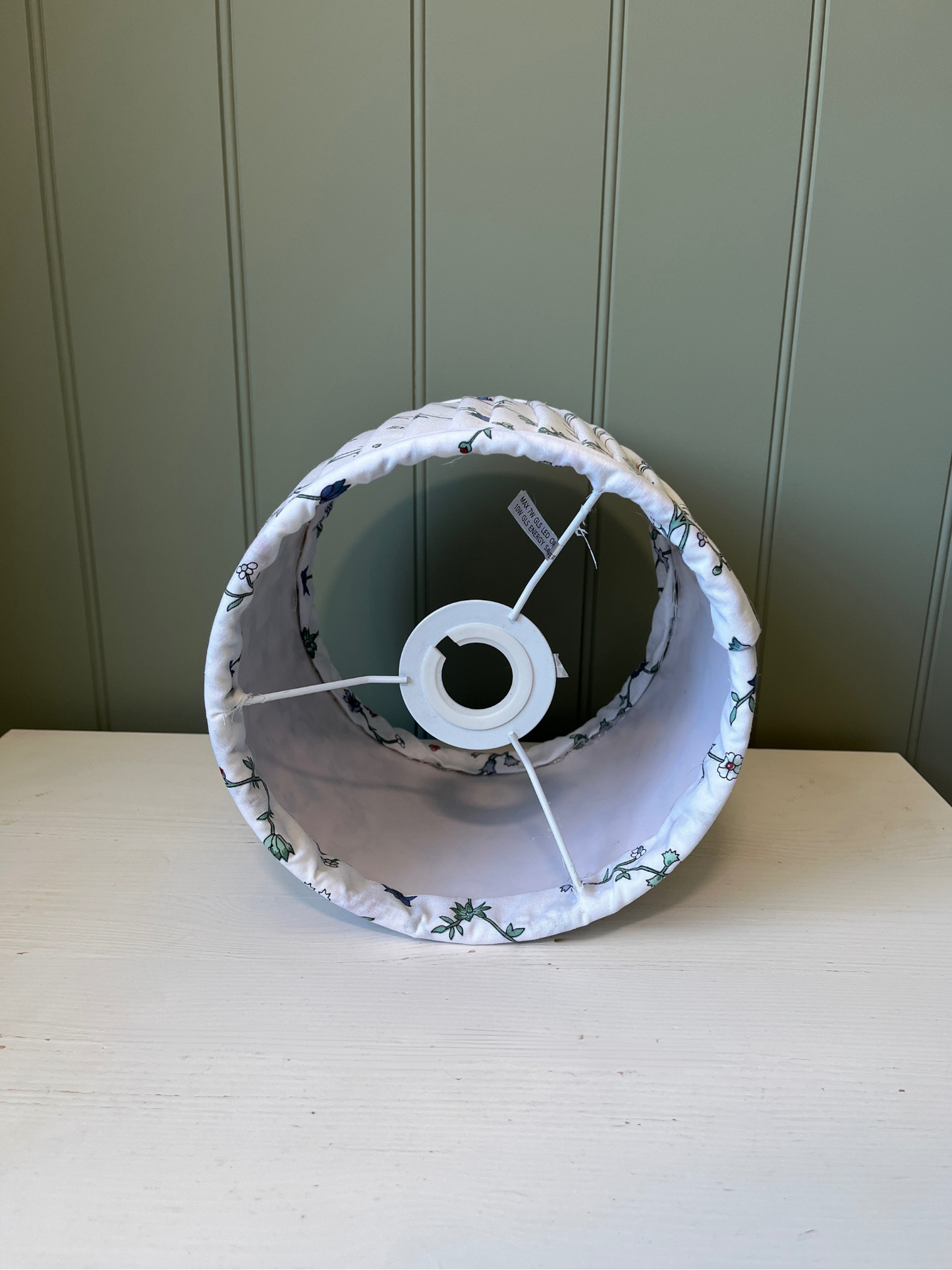 Pleated lampshade with white, red and blue floral fabric